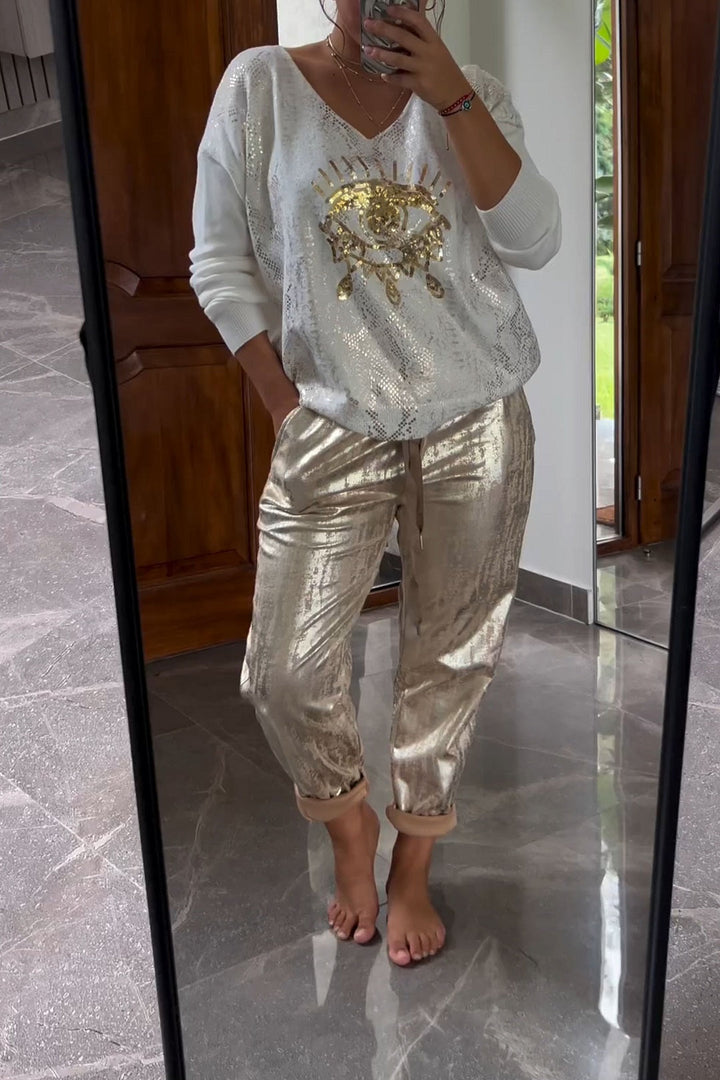 Fashionable two-piece set consisting of a sequin top and bronze-colored trousers