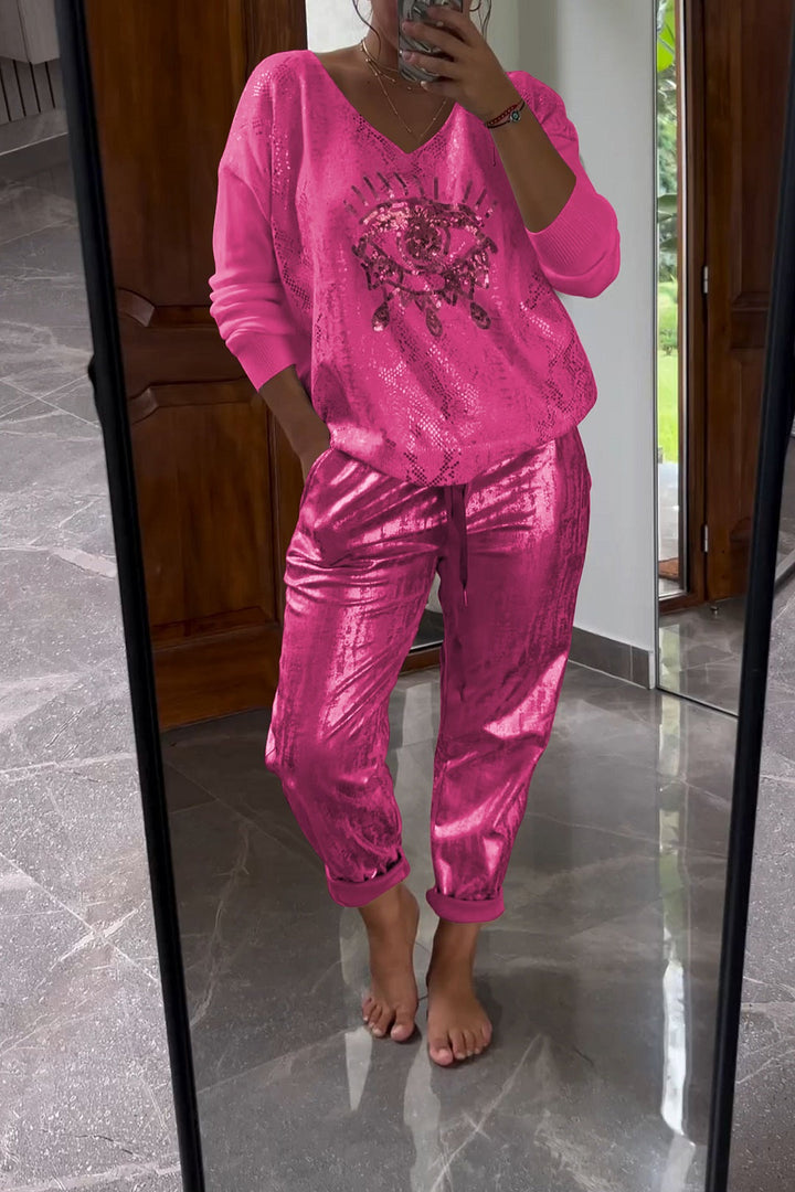 Fashionable two-piece set consisting of a sequin top and bronze-colored trousers