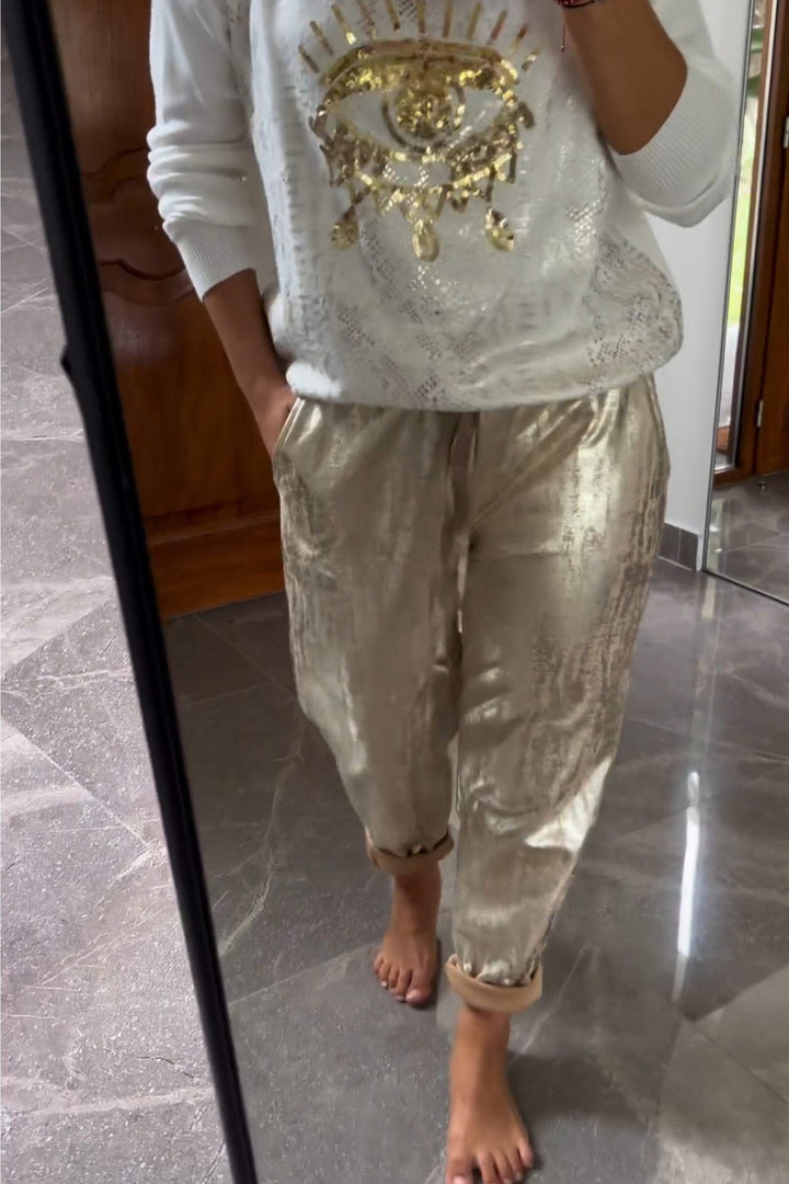 Fashionable two-piece set consisting of a sequin top and bronze-colored trousers